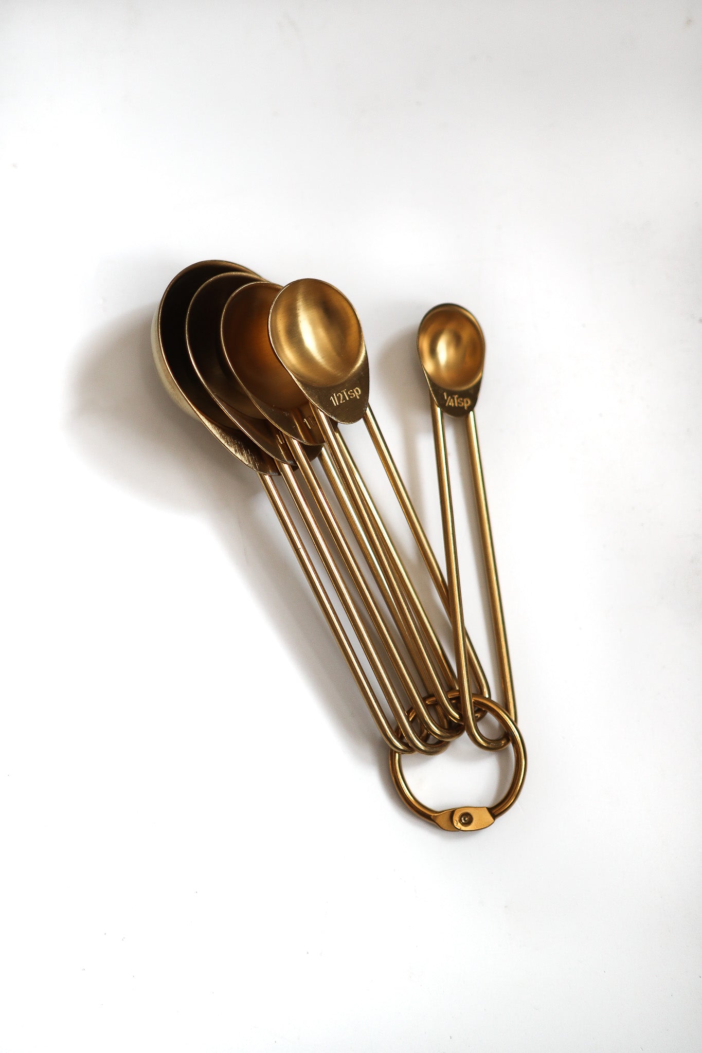 Gold measuring spoons