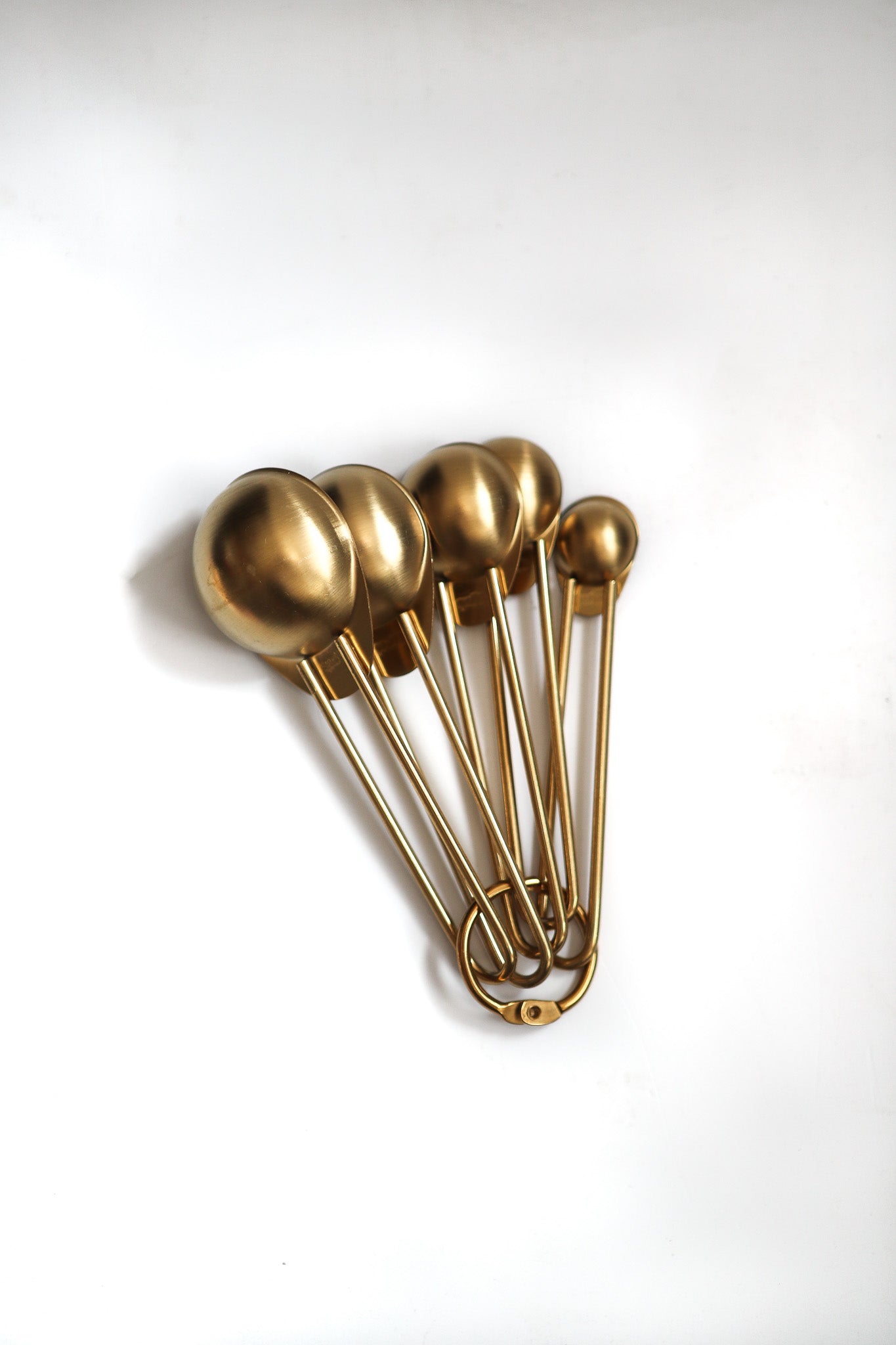 Gold measuring spoons