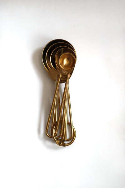 Gold measuring spoons