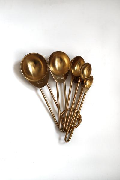 Gold measuring spoons